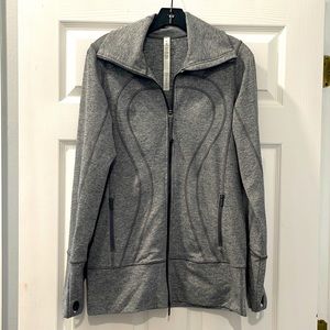 Lululemon Gray 2 pocket strechy Long jacket with zipper in front and pockets.